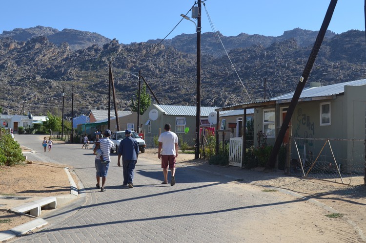 Photo of three people in a street