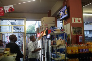 Photo of people watching  the State of the Nation address