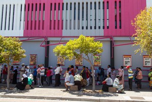 Photo of people queuing for social grants