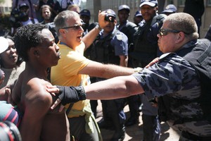 Photo of police and protesters