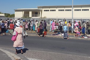 Photo of people queuing for social grants