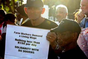 Photo of man with placard