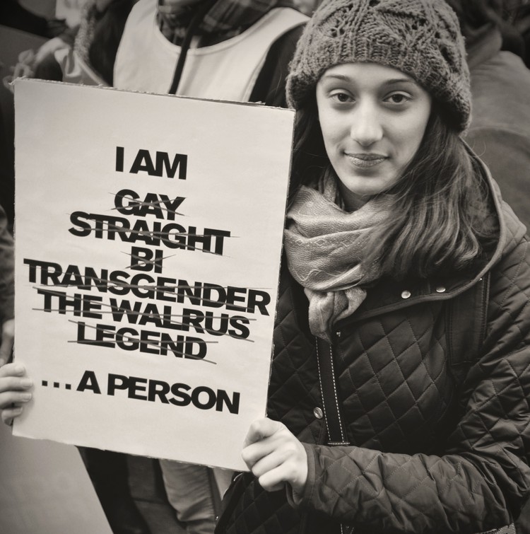 Photo of person holding poster