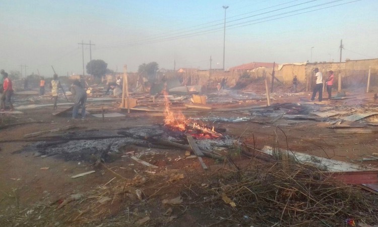 Photo of cleared shacks