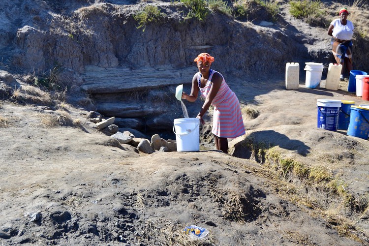 Photo of a woman gathering water