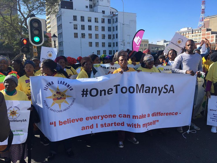 Photo of marchers with banner