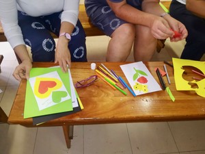 Photo of three women making artworks