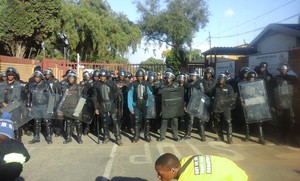 Photo of police in riot gear