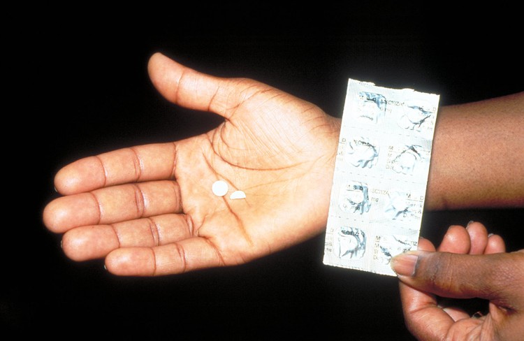 Photo of a hand with pills