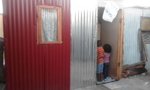 Photo of children in shack