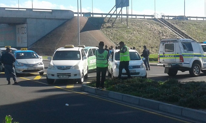 Photo of metre taxi drivers blocking road to Cape Town airport