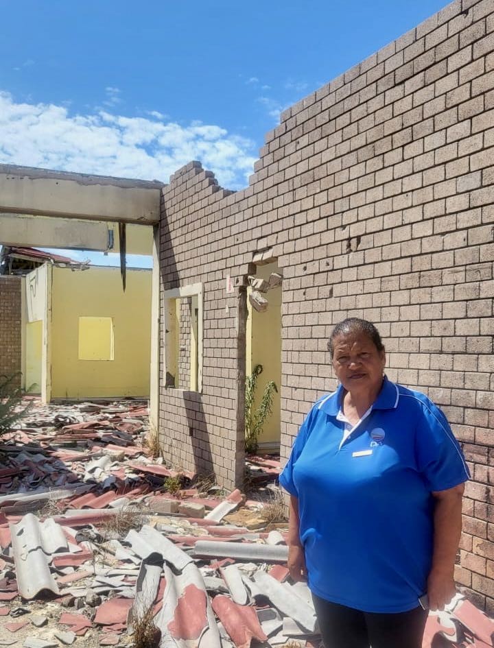 Photo of woman standing in ruins