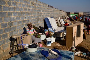 Photo of people sitting in the open