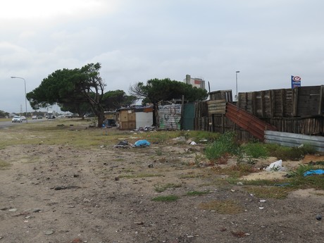 photo of shacks against wall