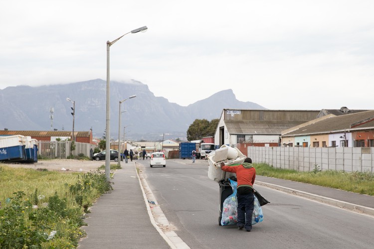 Photo of a man pushing a trolley