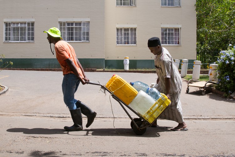 Photo of people moving water