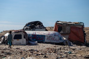 Photo of an upturned boat and bakkie canopies