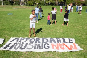 Photo of children playing and a banner