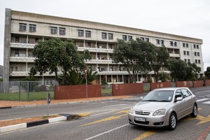 Residents occupy the old Helen Bowden Nurses Home near the V&A Waterfront in Cape Town.