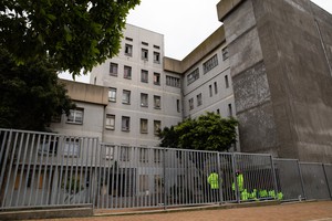 Residents occupy the old Helen Bowden Nurses Home near the V&A Waterfront in Cape Town.