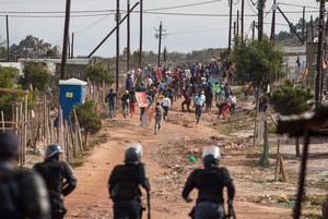 Photo of police and protesting workers