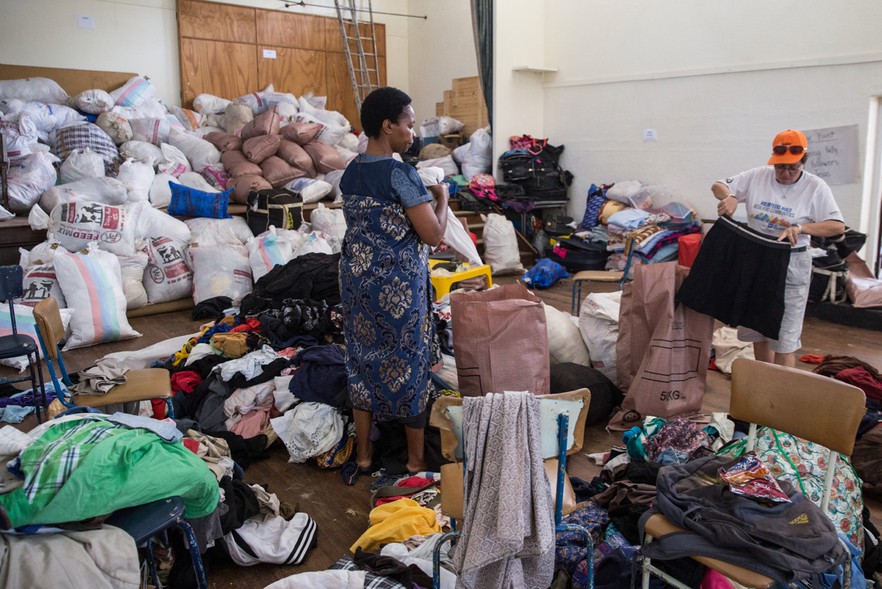 Photo of people packing food in hall