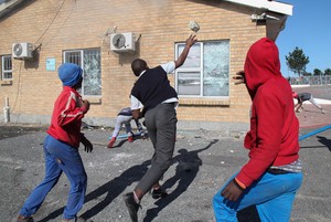 Photo of boy throwing rock