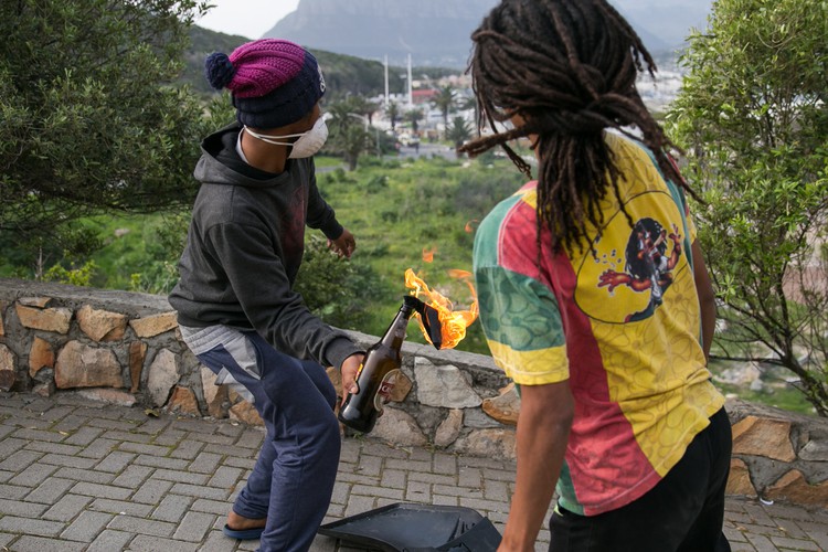 Photo of Hangberg resident throwing petrol bomb