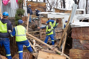 Photo of shacks being demolished