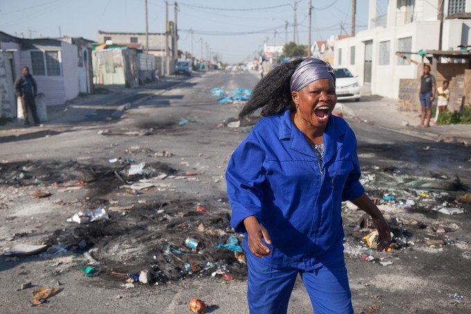 Photo of woman running during protest