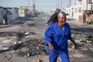 Photo of woman running during protest