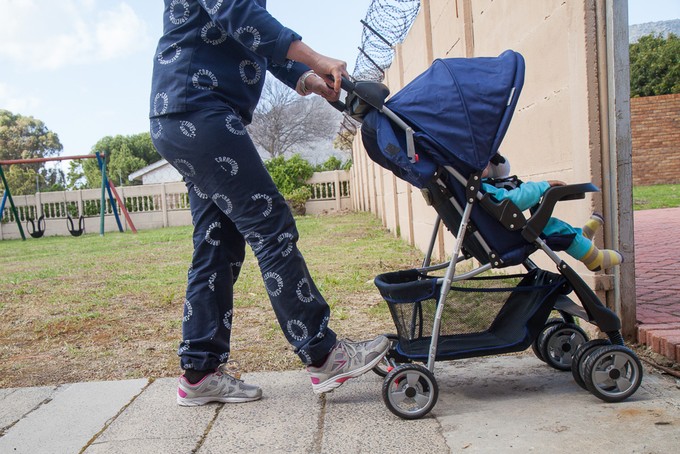 Photo of woman prisoner pushing baby