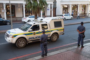 Photo of police officers and vehicle