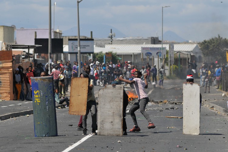 Photo of children throwing stones