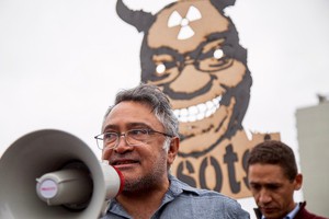 Photo of Zackie Achmat with a megaphone