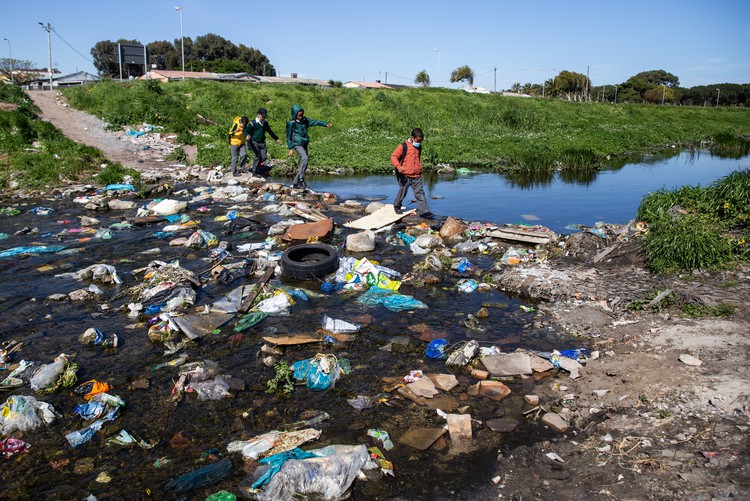 Photo of kids crossing a river