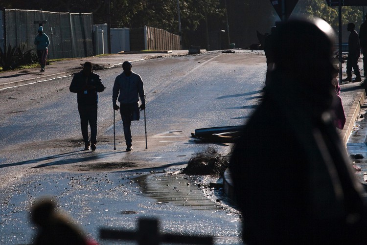 Photo of a figure on crutches