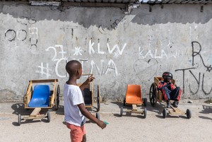 Children race go-karts in township