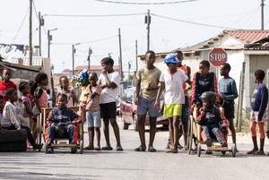 Children race go-karts in township