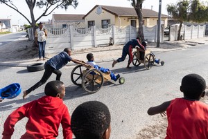 Children race go-karts in township