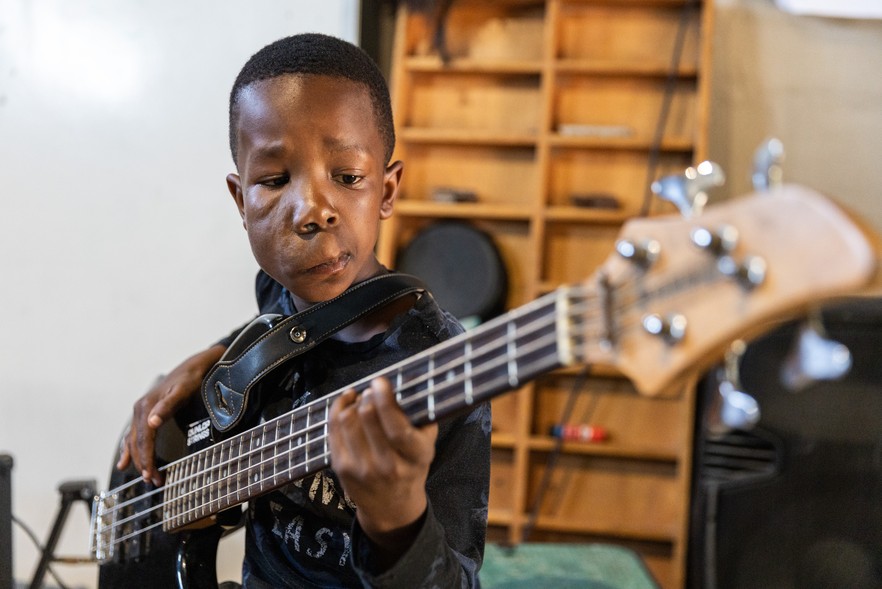 Photo of person playing guitar