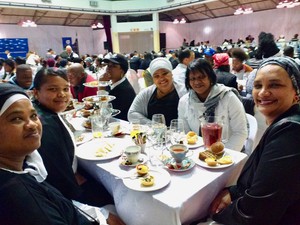 Photo of a group of ladies having tea and cake