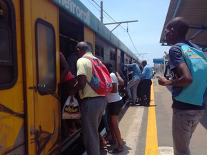 Photo of people getting onto a train