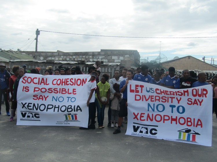 Photo of people with banners