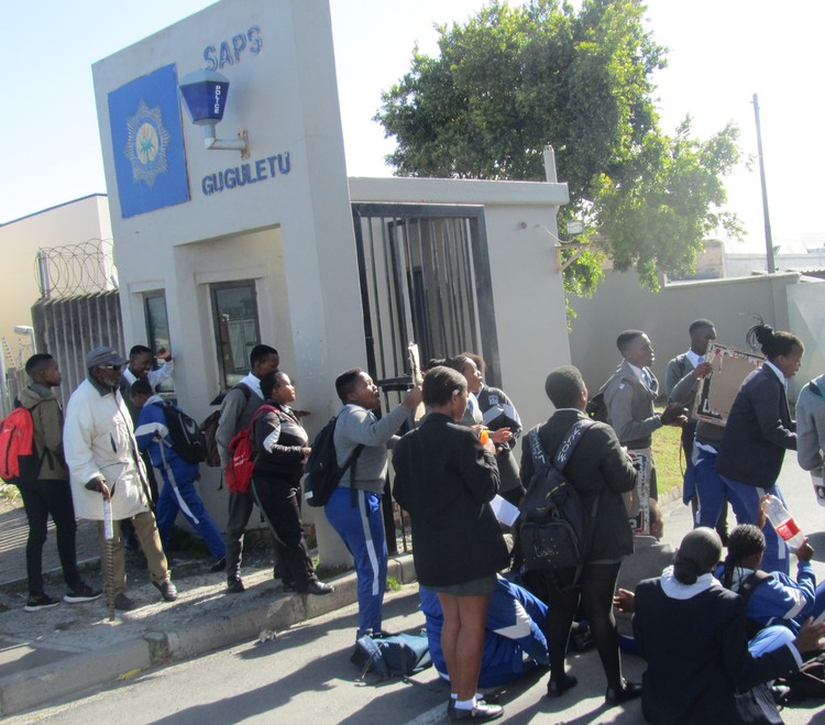 Photo of protesters at police station