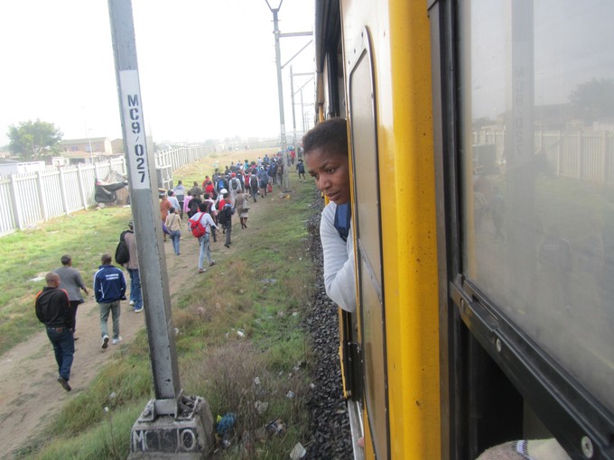 Photo of woman looking out train