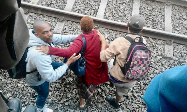 Photo of people on a railway track