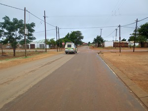 Photo of empty streets and a police van