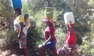 Photo of women walking to the river