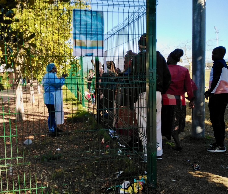 Photo of people at a fence